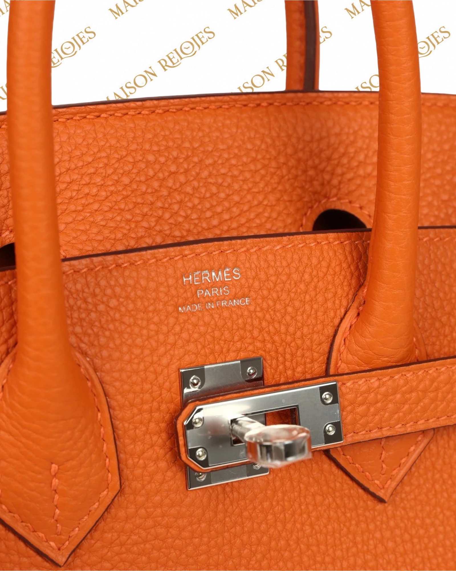 Hermès Birkin 25 Orange Minium en piel Togo con herrajes de paladio PHW — detalle del cierre y sello