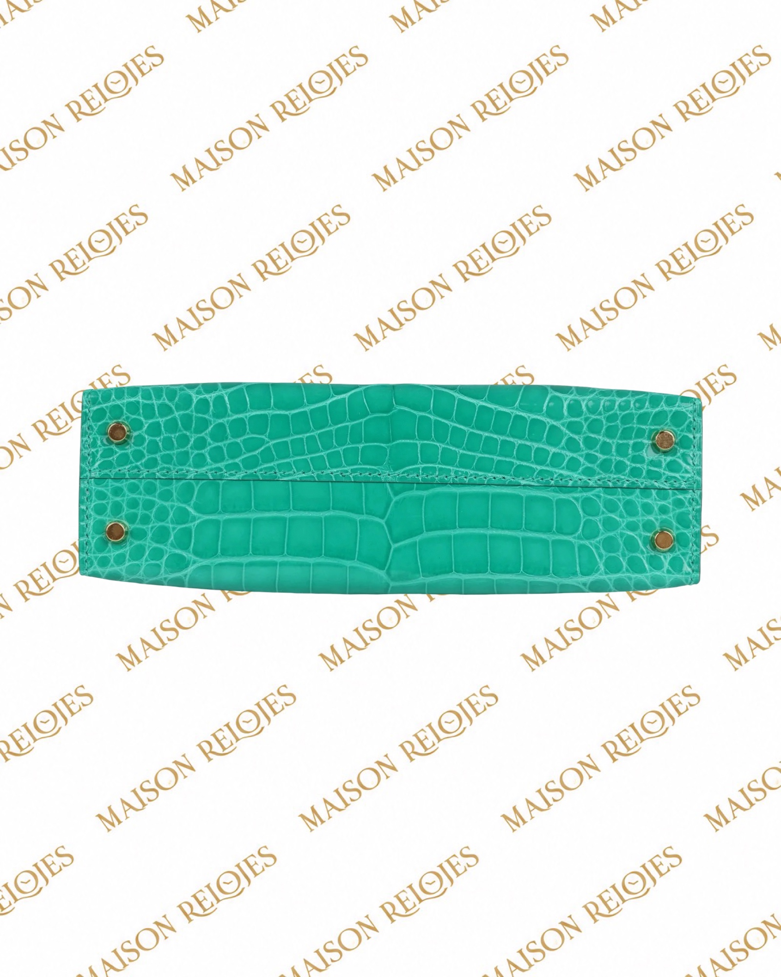 Hermès Mini Kelly 20 Sellier Vert Jade en aligátor brillante con herrajes dorados GHW — detalle de la base